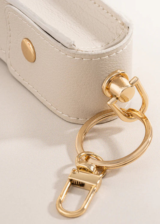 Olcay Gulsen lip oil key chain