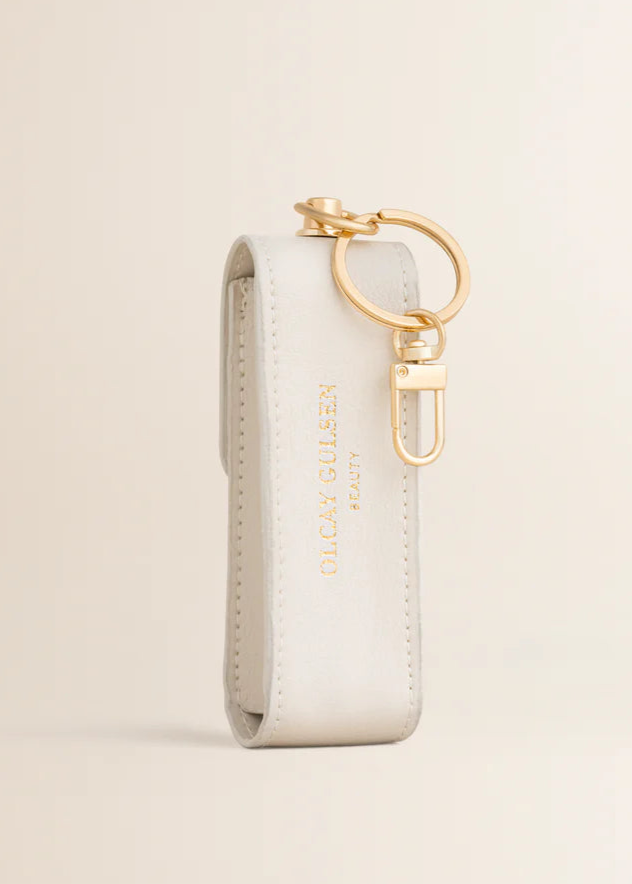 Olcay Gulsen lip oil key chain