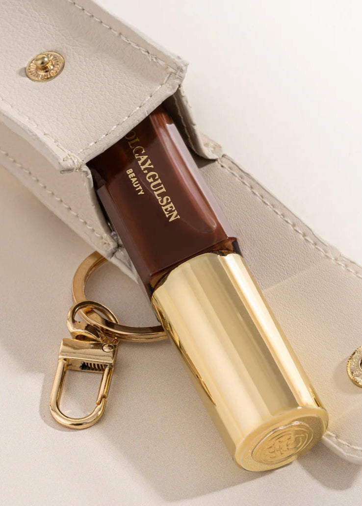 Olcay Gulsen lip oil key chain